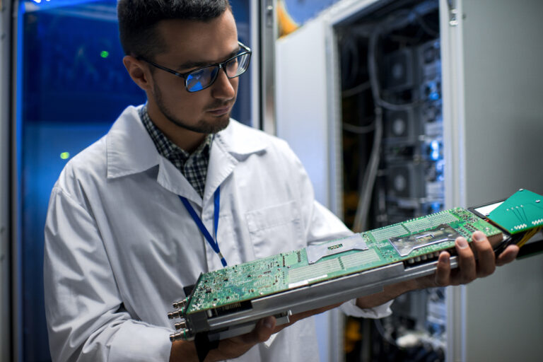 scientist inspecting supercomputer T9JJLVA 1 scaled